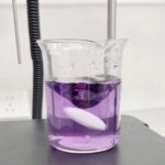 Bench photo showing unstable magnetic stirring with an off-center stir bar in a beaker